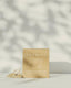 Product packaging with 'Promise' branding on a neutral background