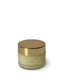 Cosmetic jar with gold lid on a white background