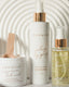 Assorted skincare products with 'Promise' branding on a neutral background