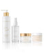 Four skincare products from PROMISE on a clean white background: a white face wash bottle with a gold pump, a clear toner mist bottle with a white spray top, a clear renewal mask jar with a gold lid, and a white cream jar with a gold lid.