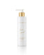 A white cylindrical pump bottle of PROMISE face wash with a gold pump collar and gold lettering, set against a clean white background with a soft reflection below.